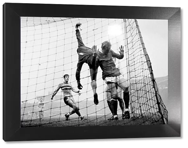 Manchester United versus West Ham. Denis Law ends up in the net as West Ham keeper