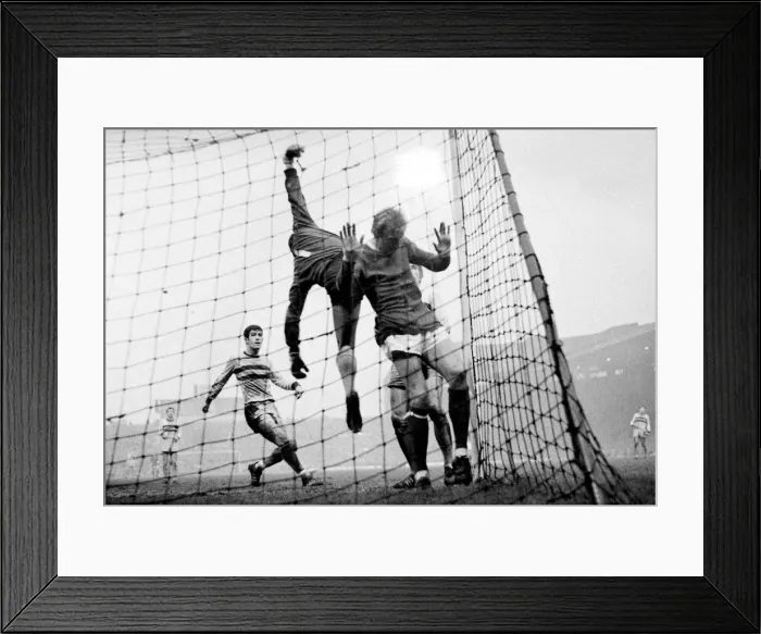 Framed Print : Manchester United versus West Ham. Denis Law ends up in the net as West Ham keeper Framed Print : Manchester United versus West Ham. Denis Law ends up in the net as West Ham keeper