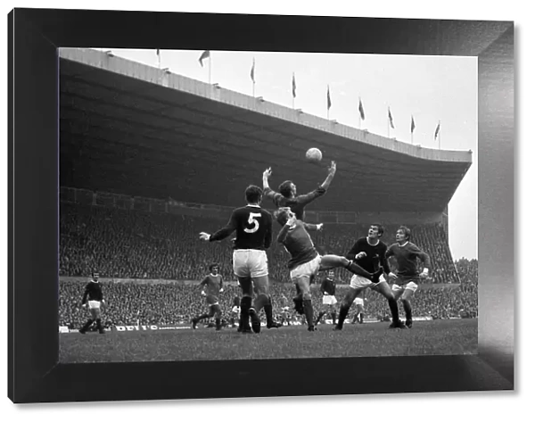 Arsenal goalkeeper Bob Wilson comes out to claim a high cross from John Fitzpatrick