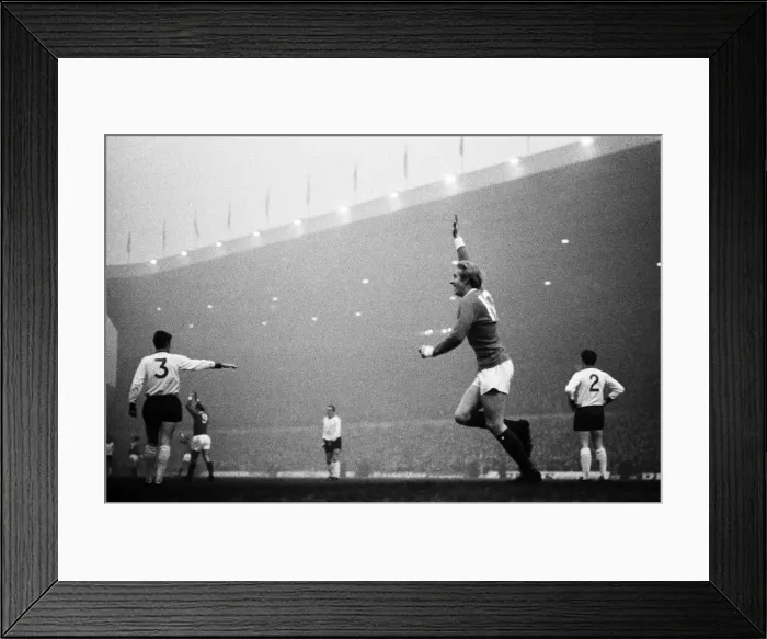 Framed Print : Manchester United forward Denis Law celebrates after he scored the game Framed Print : Manchester United forward Denis Law celebrates after he scored the game