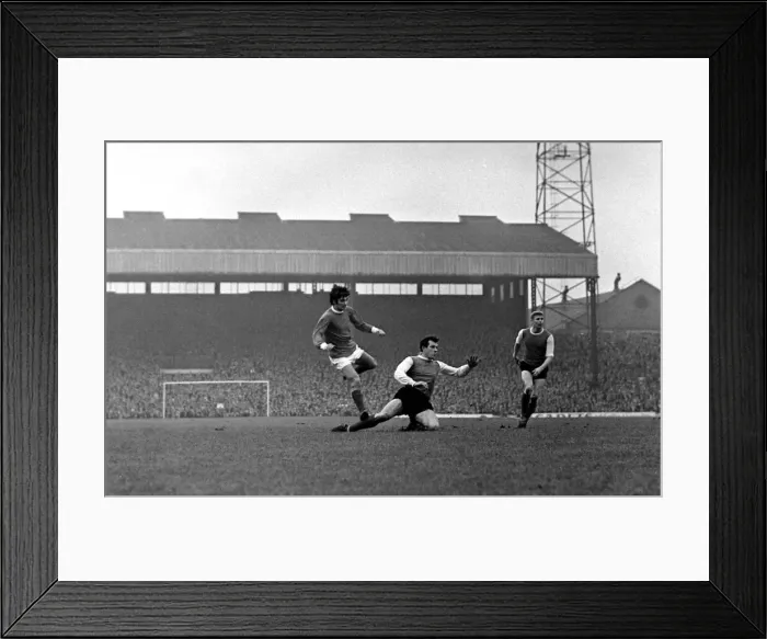 Framed Print : George Best scores a goal for Manchester United past Sheffield Wednesday defender Johnny Framed Print : George Best scores a goal for Manchester United past Sheffield Wednesday defender Johnny