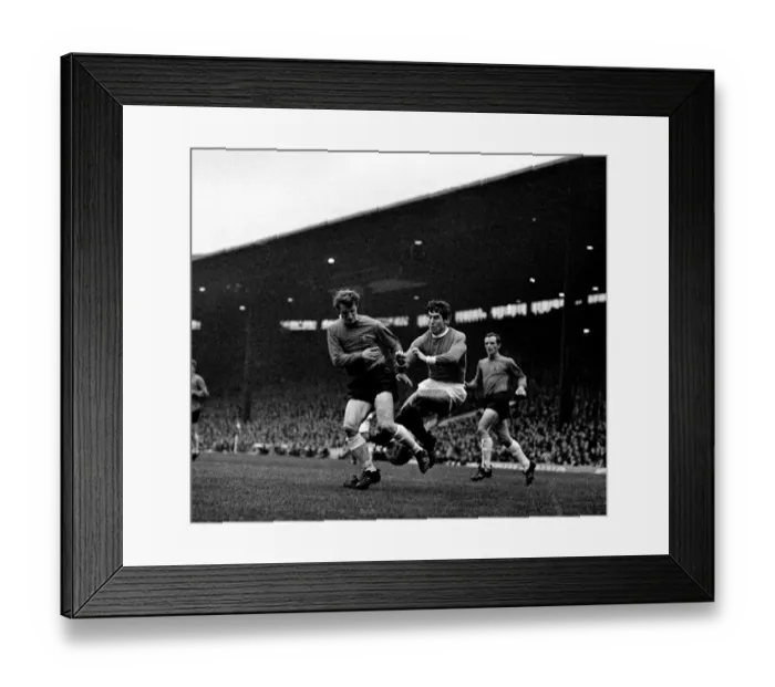 Framed Print : Manchester Uniteds left back Tony Dunne comes flying in to halt an Ipswich player