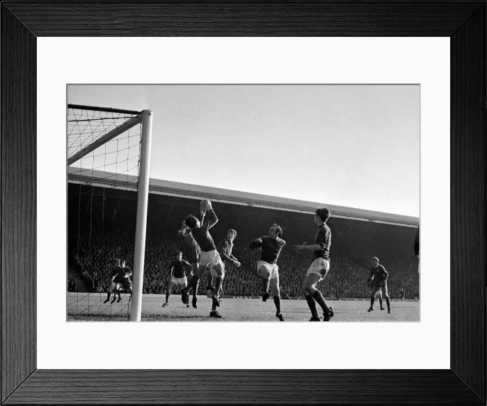 Framed Print : Liverpool forward Ron Yeats surrounded by manchester United players as Alex Stepney drops Framed Print : Liverpool forward Ron Yeats surrounded by manchester United players as Alex Stepney drops