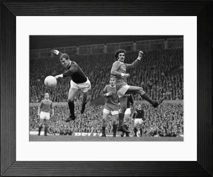 Framed Print : Manchester Uniteds George Best goes for the ball during the league match against Framed Print : Manchester Uniteds George Best goes for the ball during the league match against
