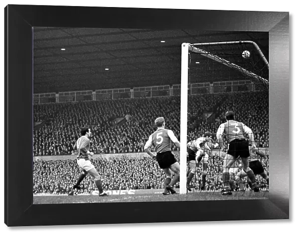 Manchester United forward Denis Law shoots over the Sheffield Wednesday goal following a