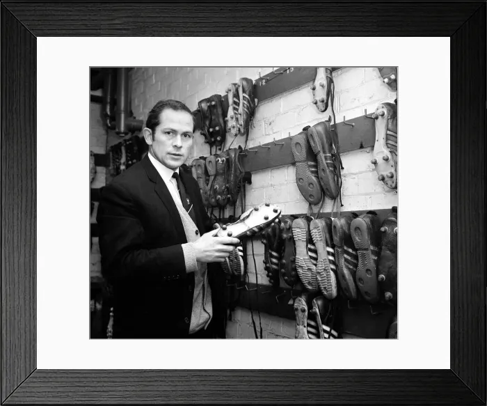 Framed Print : Manchester United assistant trainer Wilf McGuinness inspects one of the five types of Framed Print : Manchester United assistant trainer Wilf McGuinness inspects one of the five types of