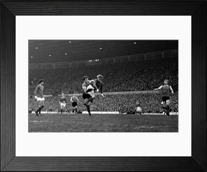Framed Print : Denis Law of Manchester United beats a Sheffield Wednesday defender to fire a shot in Framed Print : Denis Law of Manchester United beats a Sheffield Wednesday defender to fire a shot in