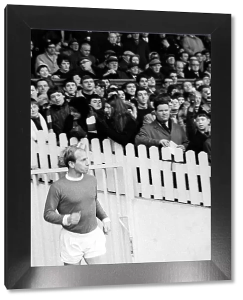 Bobby Charlton of Manchester United walk on to the pitch at old Trafford for the league