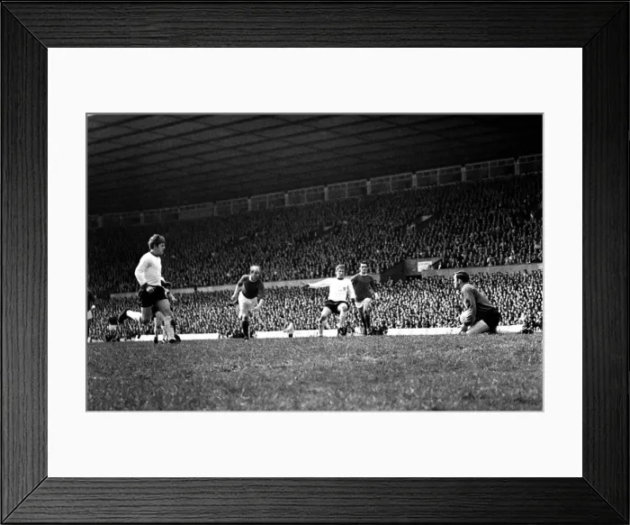 Framed Print : Goal scoring chance for Manchester United as Bobby Charlton rushes towards goal during Framed Print : Goal scoring chance for Manchester United as Bobby Charlton rushes towards goal during