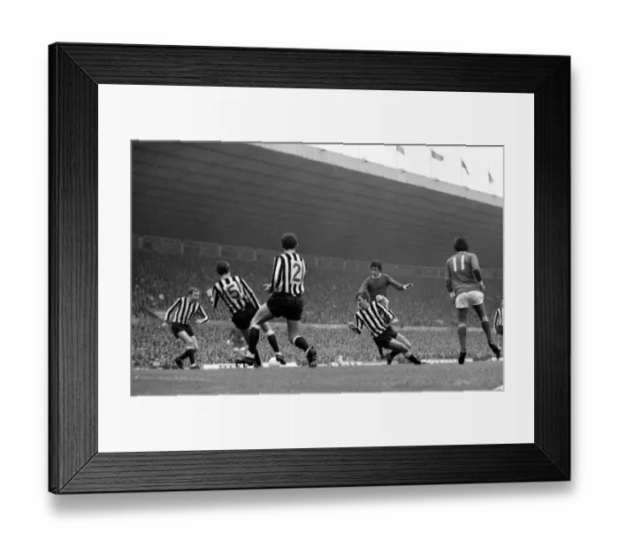 Framed Print : Manchester Uniteds Willie Morgan takes on four Newcastle united defenders in a goal