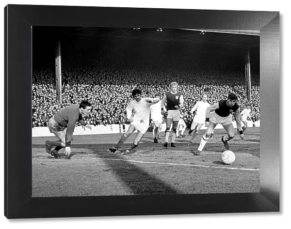 The ball comes across the box for Manchester United star George Best to score his sides