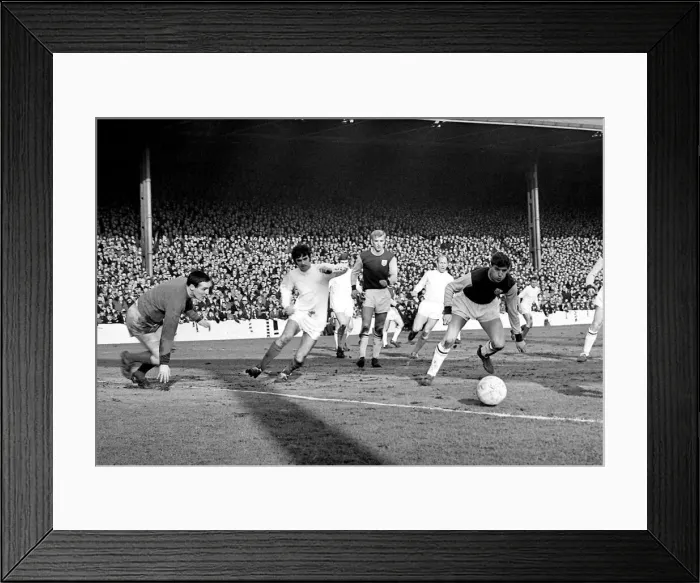 Framed Print : The ball comes across the box for Manchester United star George Best to score his sides