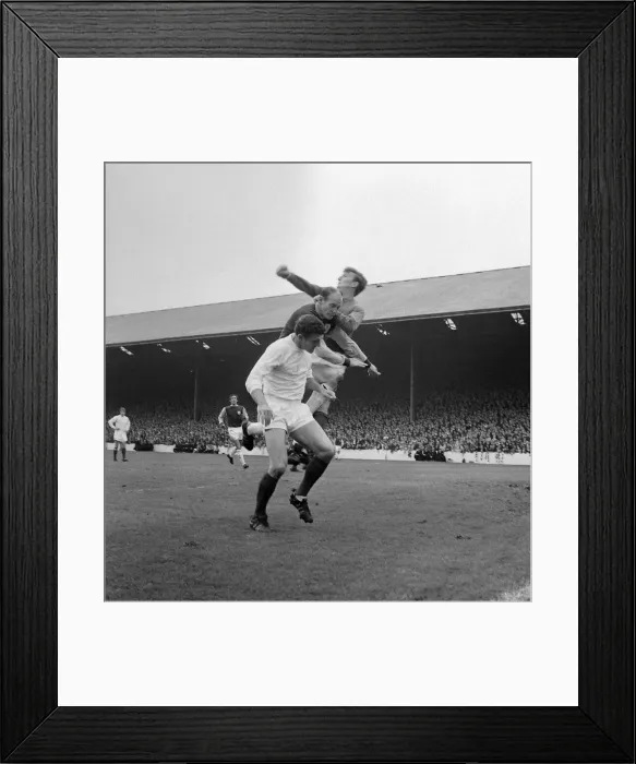 Framed Print : Manchester United centre-half Bill Foulkes and keeper Alex Stepney in action clearing a Framed Print : Manchester United centre-half Bill Foulkes and keeper Alex Stepney in action clearing a