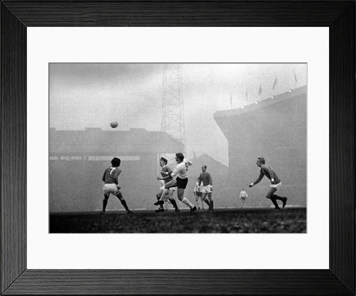 Framed Print : Manchester Uniteds George Best, Francis Burns and Bobby Charlton watch the ball as Framed Print : Manchester Uniteds George Best, Francis Burns and Bobby Charlton watch the ball as