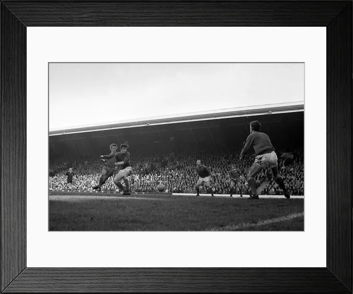 Framed Print : Liverpool forward Alun Evans shoots at the manchester United goal as Nobby Stiles Framed Print : Liverpool forward Alun Evans shoots at the manchester United goal as Nobby Stiles