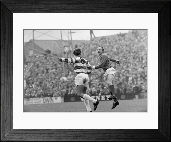 Framed Print : QPR v Manchester United Nobby Stiles goes for a high ball during the two team Framed Print : QPR v Manchester United Nobby Stiles goes for a high ball during the two team