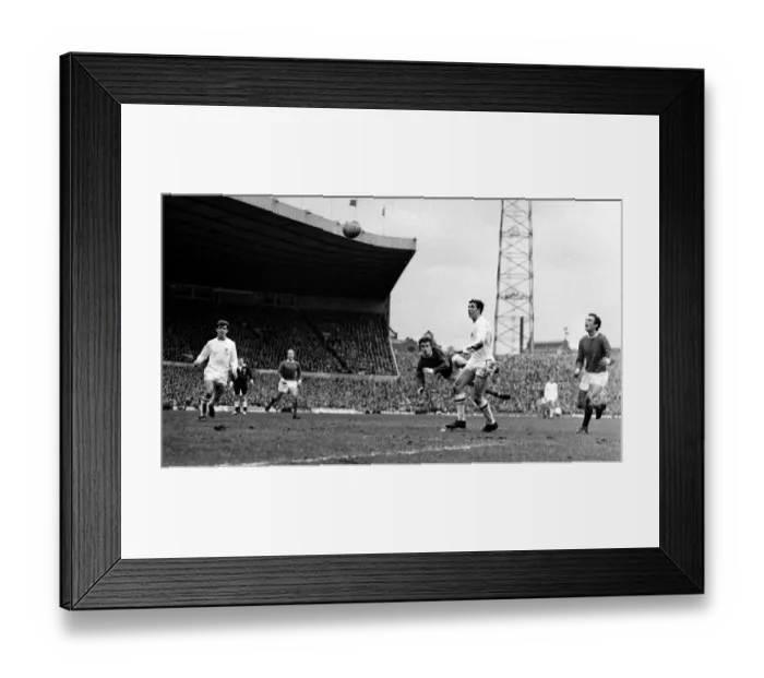 Framed Print : Manchester United on the attack with a flying header during their league match against Framed Print : Manchester United on the attack with a flying header during their league match against