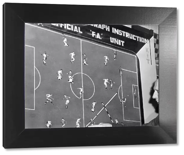 Pat Beaseley admires a new soccer coaching board, based on advice from England team