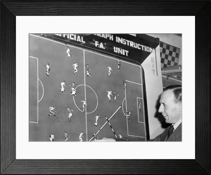 Framed Print : Pat Beaseley admires a new soccer coaching board, based on advice from England team Framed Print : Pat Beaseley admires a new soccer coaching board, based on advice from England team