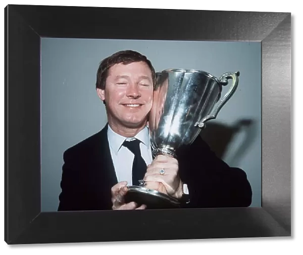 Aberdeen manager Alex Ferguson holding the European Cup Winners Cup trophy after hi side