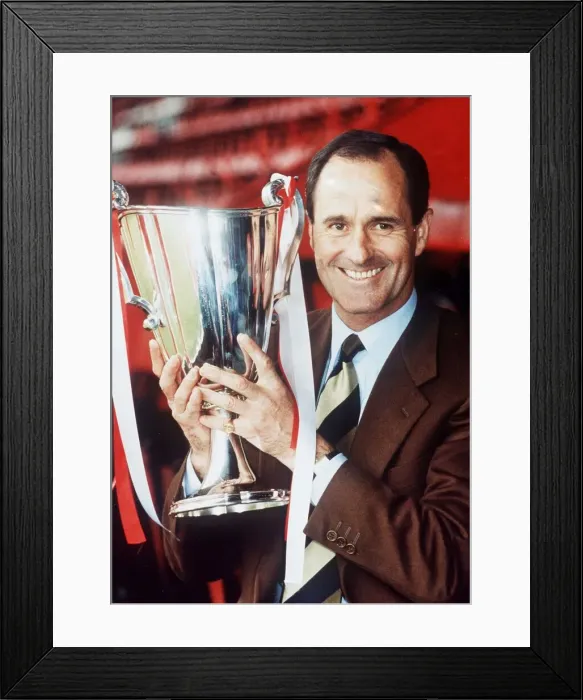 Framed Print : Arsenal manager George Graham holds the European cup winners cup trophy May 1994 Framed Print : Arsenal manager George Graham holds the European cup winners cup trophy May 1994