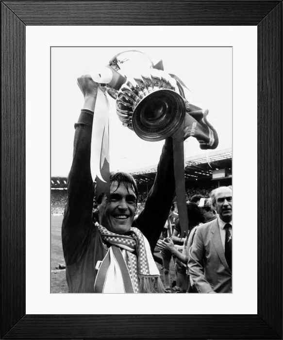 Framed Print : Liverpool player manager Kenny Dalglish holding the trophy aloft after their win against Framed Print : Liverpool player manager Kenny Dalglish holding the trophy aloft after their win against