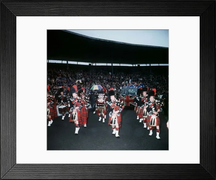 Framed Print : A Pipe band leads Rangers players in a parade around Ibrox Park on lorry with