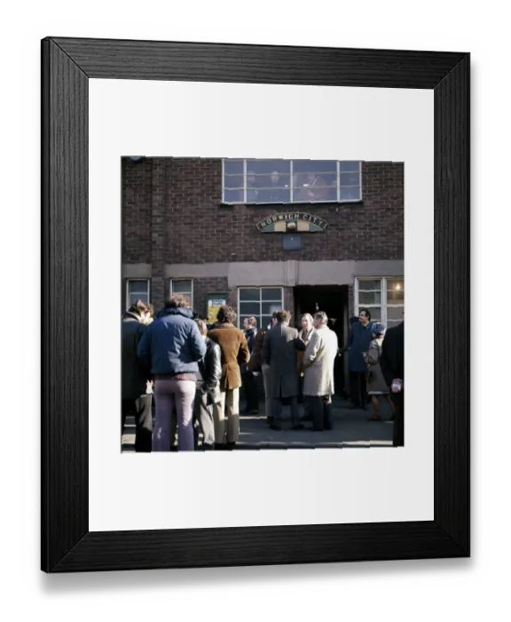 Framed Print : People gathered outside the entrance to Norwich City football club at Carrow Road