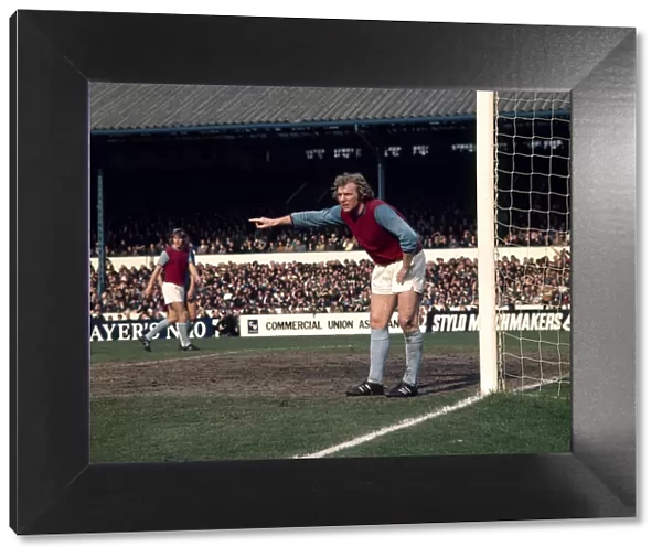 West Ham United footballer Bobby Moore shouts instructions to teammates during the league