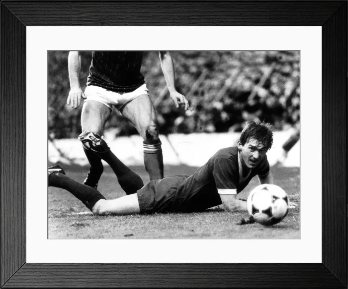 Framed Print : Kenny Dalglish watches his header go wide of the goal post during the Liverpool v Ipswich Framed Print : Kenny Dalglish watches his header go wide of the goal post during the Liverpool v Ipswich