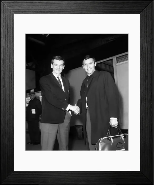  : Chelsea teamates Eddie McCreadie (left) and Barry Bridges shake hands having just heard