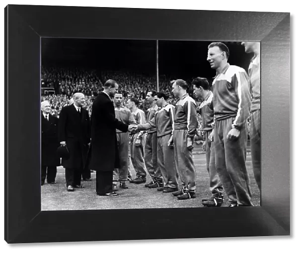 Prince Philip Duke of Edinburgh shaking hands with Manchester City Team at the start of