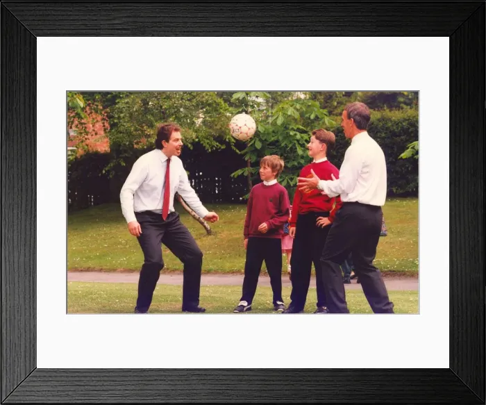 Framed Print : Prime Minister Tony Blair and ex FIFA football referee George Courtney play football