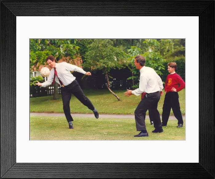 Framed Print : Prime Minister Tony Blair and ex FIFA football referee George Courtney play football Framed Print : Prime Minister Tony Blair and ex FIFA football referee George Courtney play football