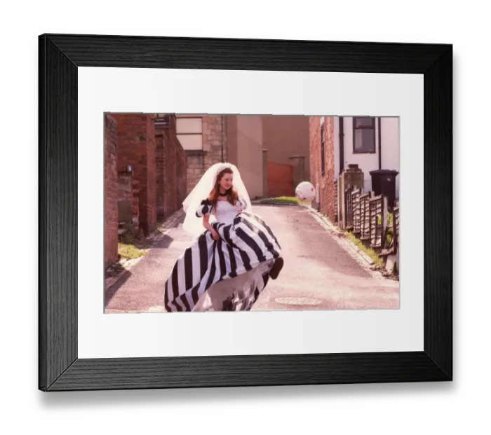 Framed Print : Sarah Robey models the black and white wedding dress which will be on show at an Framed Print : Sarah Robey models the black and white wedding dress which will be on show at an