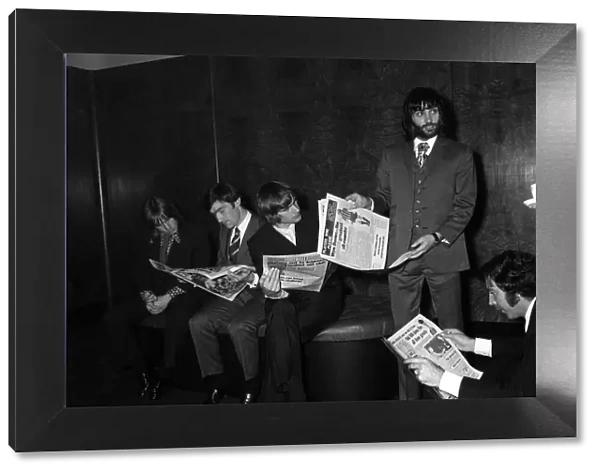 George Best with Manchester United team mates April 1971 reading the papers