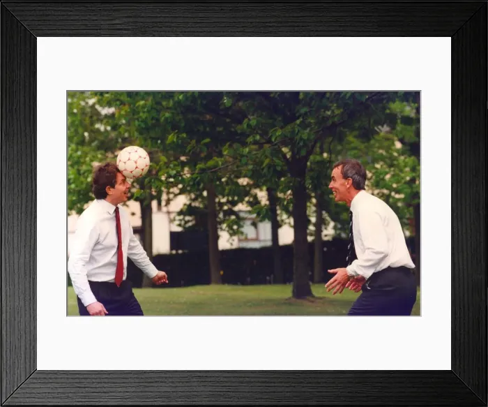Framed Print : Prime Minister Tony Blair and ex FIFA football referee George Courtney play football Framed Print : Prime Minister Tony Blair and ex FIFA football referee George Courtney play football