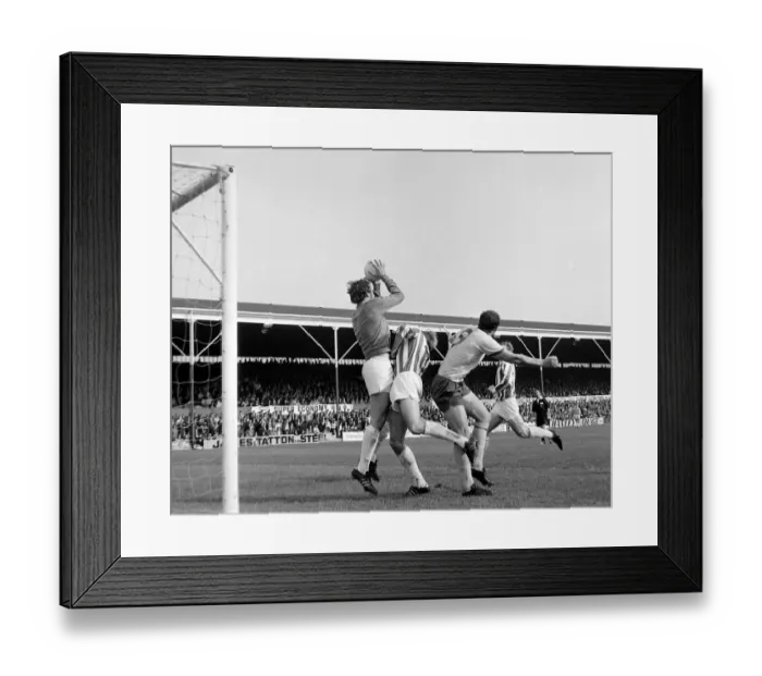 Framed Print : English League Division match Stoke City v Arsenal Stoke goalkeeper Farmer leaps up
