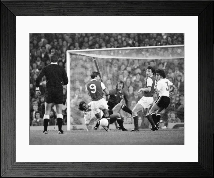 Framed Print : Arsenals attack is led by Malcolm McDonald against the Manchester United goal Framed Print : Arsenals attack is led by Malcolm McDonald against the Manchester United goal