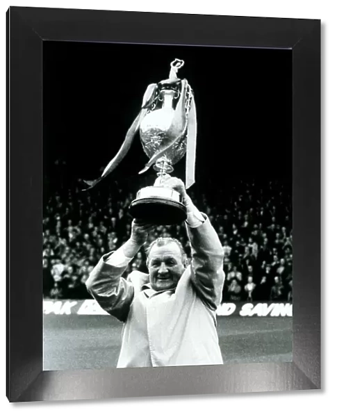 Bob Paisley ex Liverpool manager holding the League Champinship Trophy in 1983