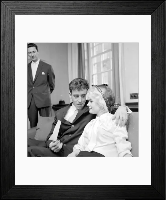 Framed Print : Pools winner Vivienne Nicholson smiles with her husband Keith Howard Nicholson holding a Framed Print : Pools winner Vivienne Nicholson smiles with her husband Keith Howard Nicholson holding a