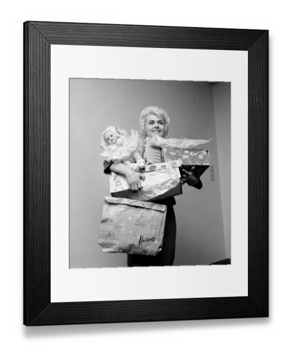Framed Print : Pools winner Vivienne Nicholson all smiles stacked up with gifts after a shopping spree