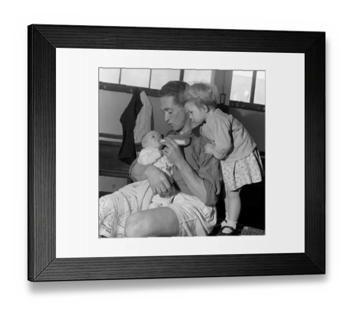 Framed Print : Neil Dougall (Plymouth Argyle) feeds his children in football dressing room