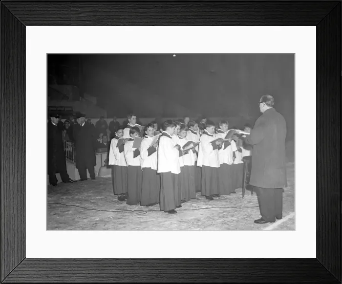 Framed Print : The choir of Holy Trinity Church, Coventry, singing carols at Highfield Road football Framed Print : The choir of Holy Trinity Church, Coventry, singing carols at Highfield Road football