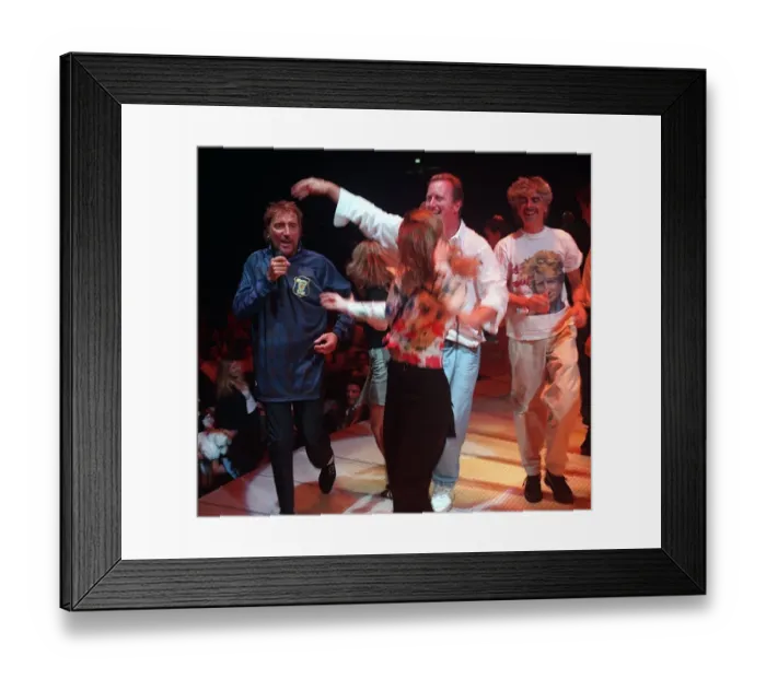 Framed Print : Rod Stewart pop star wearing a Scotland football strip singing on stage during his
