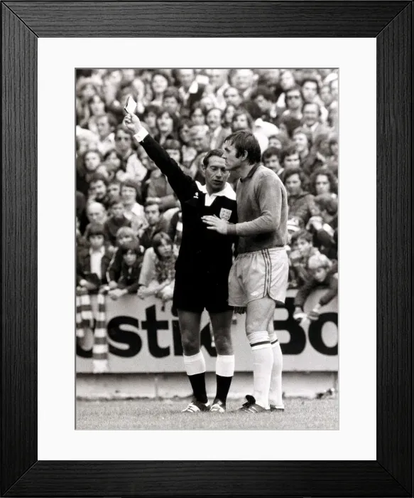 Framed Print : Footballer Jimmy Rimmer is booked by referee for marking the pitch