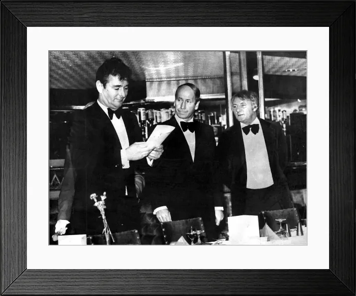 Framed Print : Tommy Docherty (R) at a boxing match in a Manchester nightclub where Bobby Charlton acts