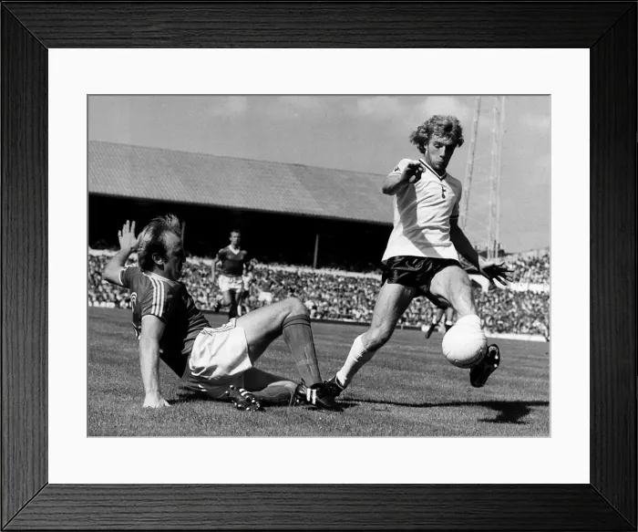 Framed Print : Tottenham Hotspur versus Nottingham Forrest. 1980. Kenny Burns tackles Steve Framed Print : Tottenham Hotspur versus Nottingham Forrest. 1980. Kenny Burns tackles Steve