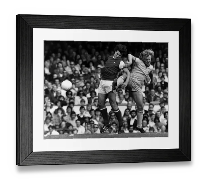 Framed Print : Arsenal versus Nottingham Forrest, 1977. Kenny Burns tackles Frank Stapleton