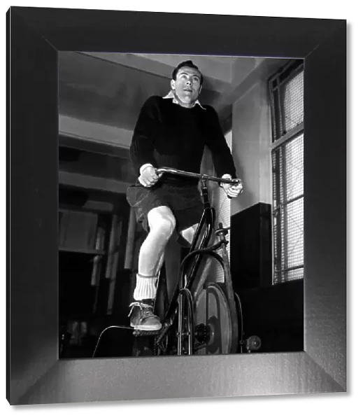 Jack Kelsey (Goalkeeper) Football Player of Arsenal - 1957 on a exercise bike